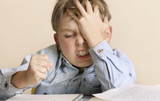 Frustrated boy doing homework