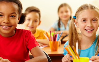 Girls in school smiling
