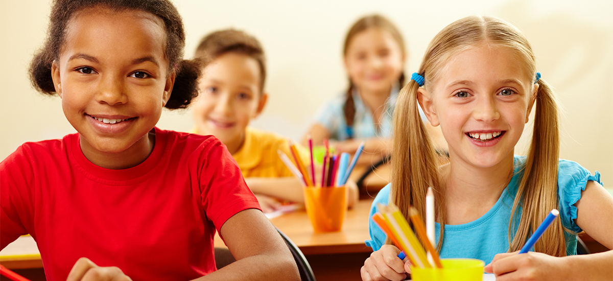 Girls in school smiling